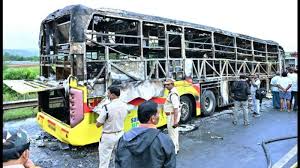 Aftermath of Kurnool bus fire with investigators examining the vehicle where phones and high-voltage batteries were found