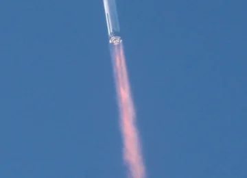 SpaceX Starship rocket launching from Starbase during a flight test