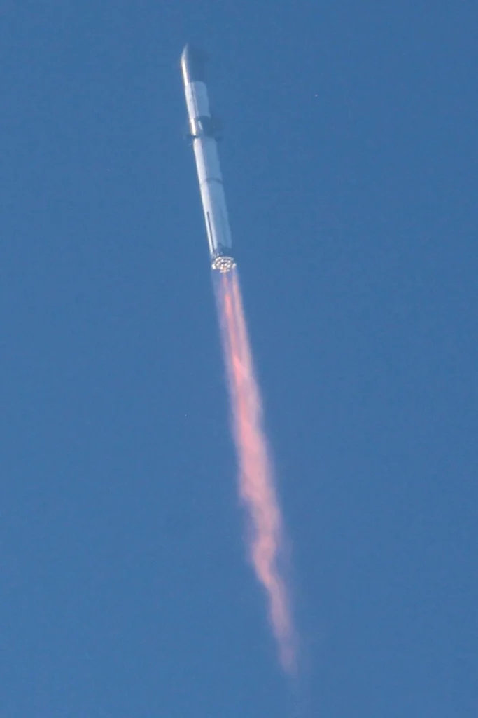 SpaceX Starship rocket launching from Starbase during a flight test