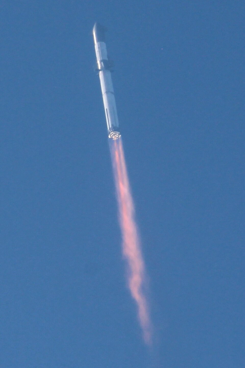 SpaceX Starship rocket launching from Starbase during a flight test